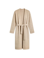 Бежевий вовняний вʼязаний кардиган Merin з поясом на білому фоні, вид спереду