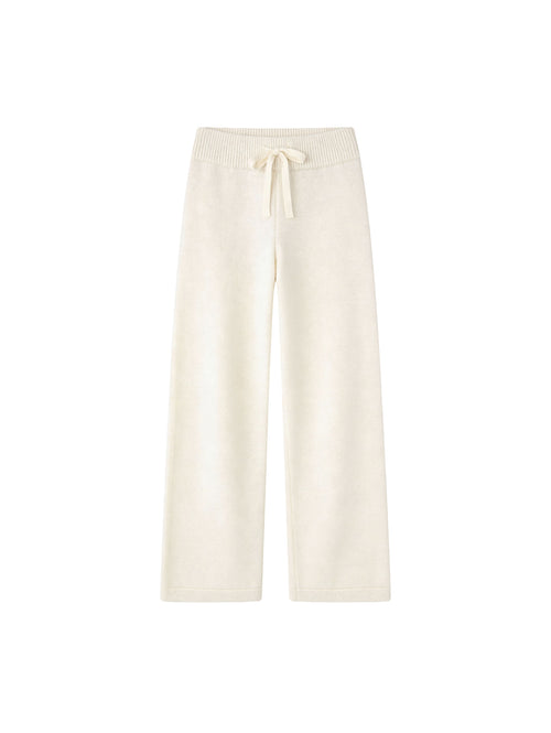 Молочні вʼязані штани Merin із 100% мериносу на білому фоні 