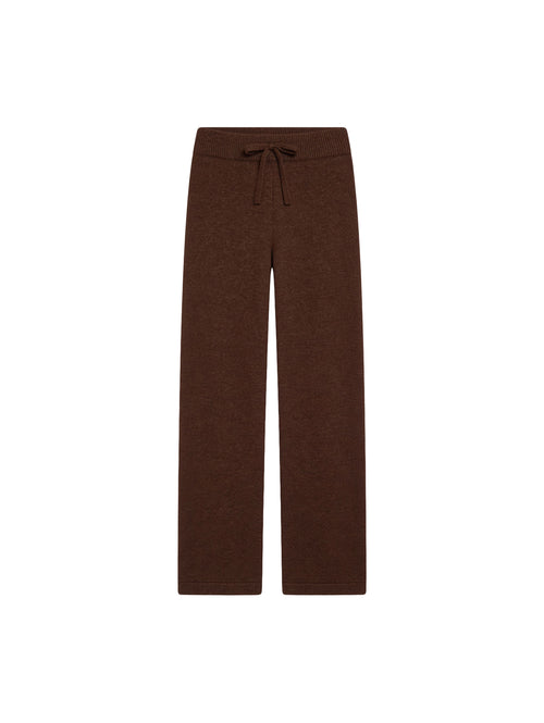 Коричневі вʼязані штани Merin із 100% мериносу на білому фоні 
